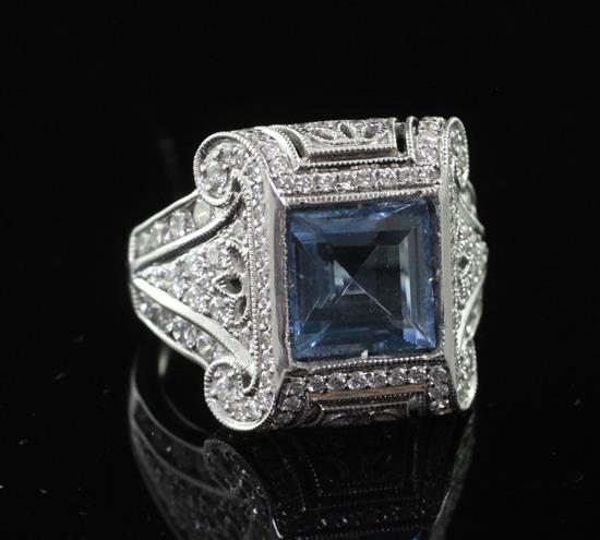 An 18ct white gold, aquamarine and diamond dress ring, size N.